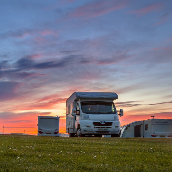 Campig with a camper van at dusk
